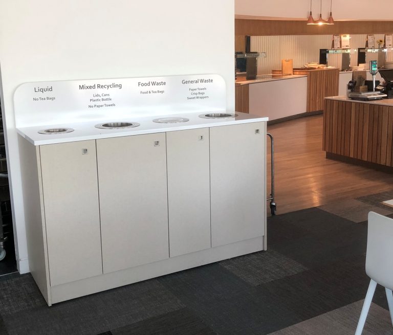 modern white recycling station in cabinet at large UK offices
