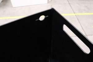 bag retention hole on waste container for inside cabinets